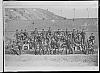 Reprodukce fotografie vojáků, na sudu: Tábor, J. K. 1880 31.1, Na druhém sudu:K.K.b.I.W. BAON, Tabor No 46