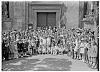 skupina před kostelem na náměstí Mikuláše z Husi (in Czech), keywords: církev., Hus, náměstí Mikuláše z Husi